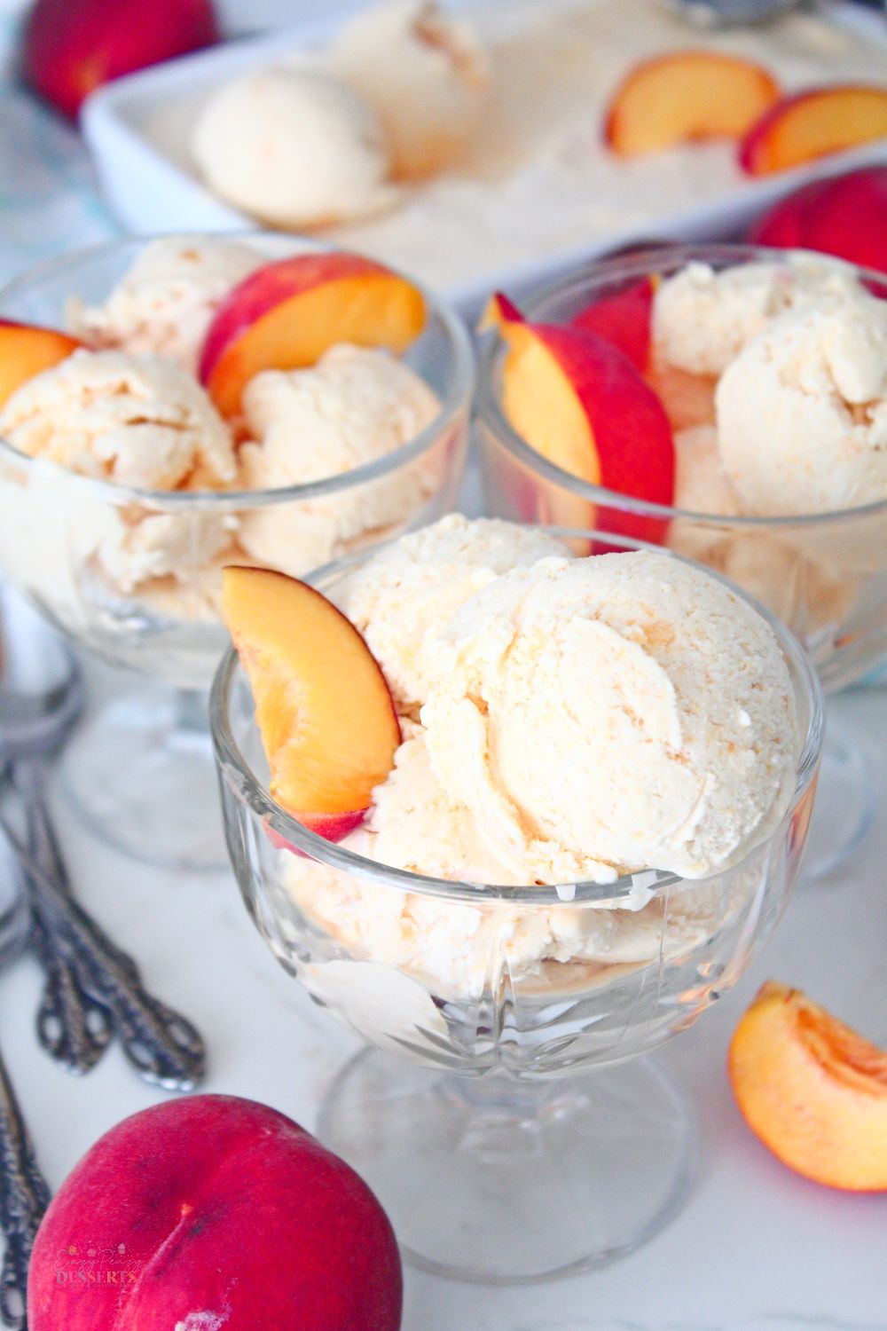Peaches and cream ice cream in ice cream bowls