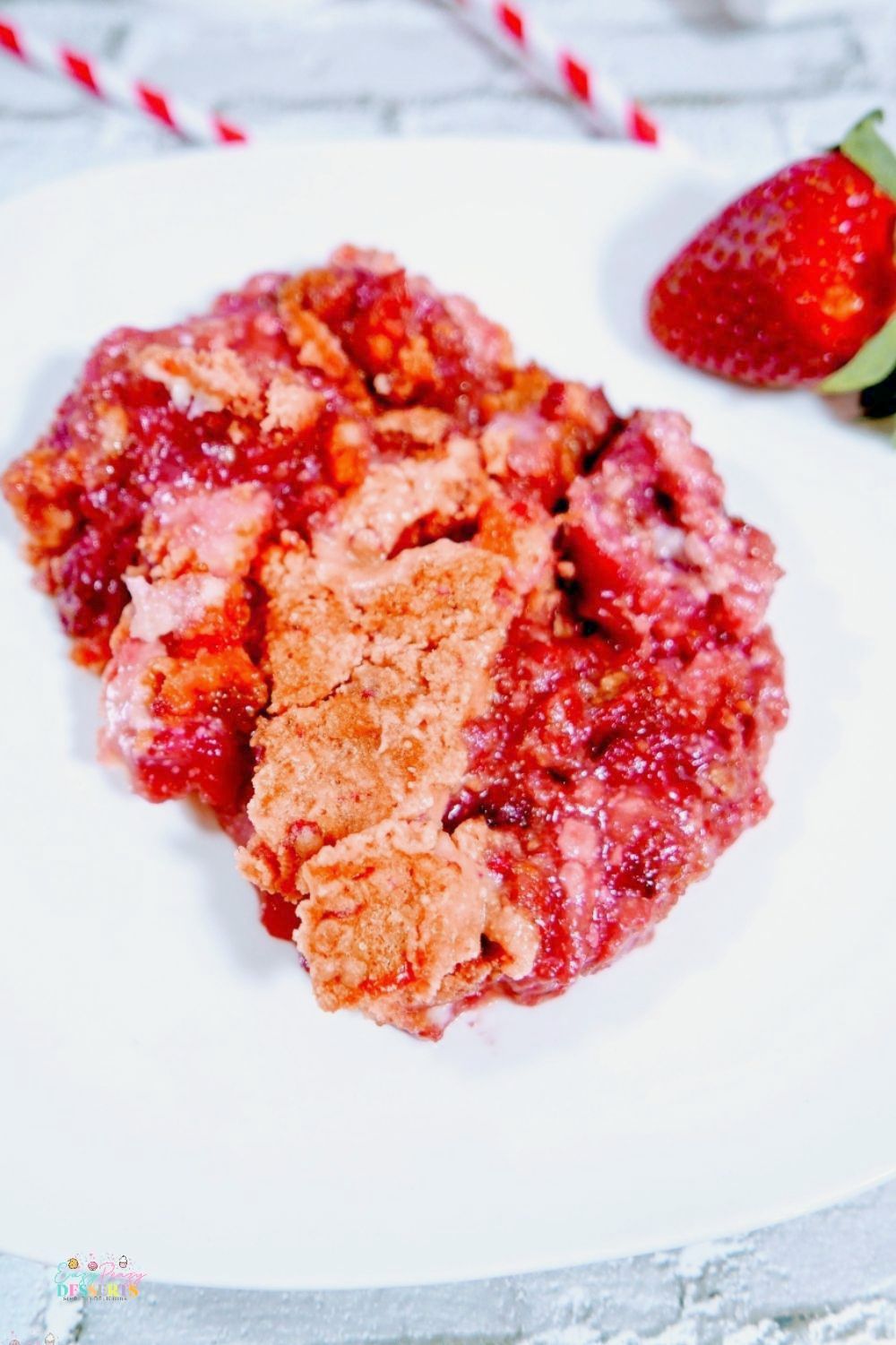 Strawberry cake crumble in a white serving plate