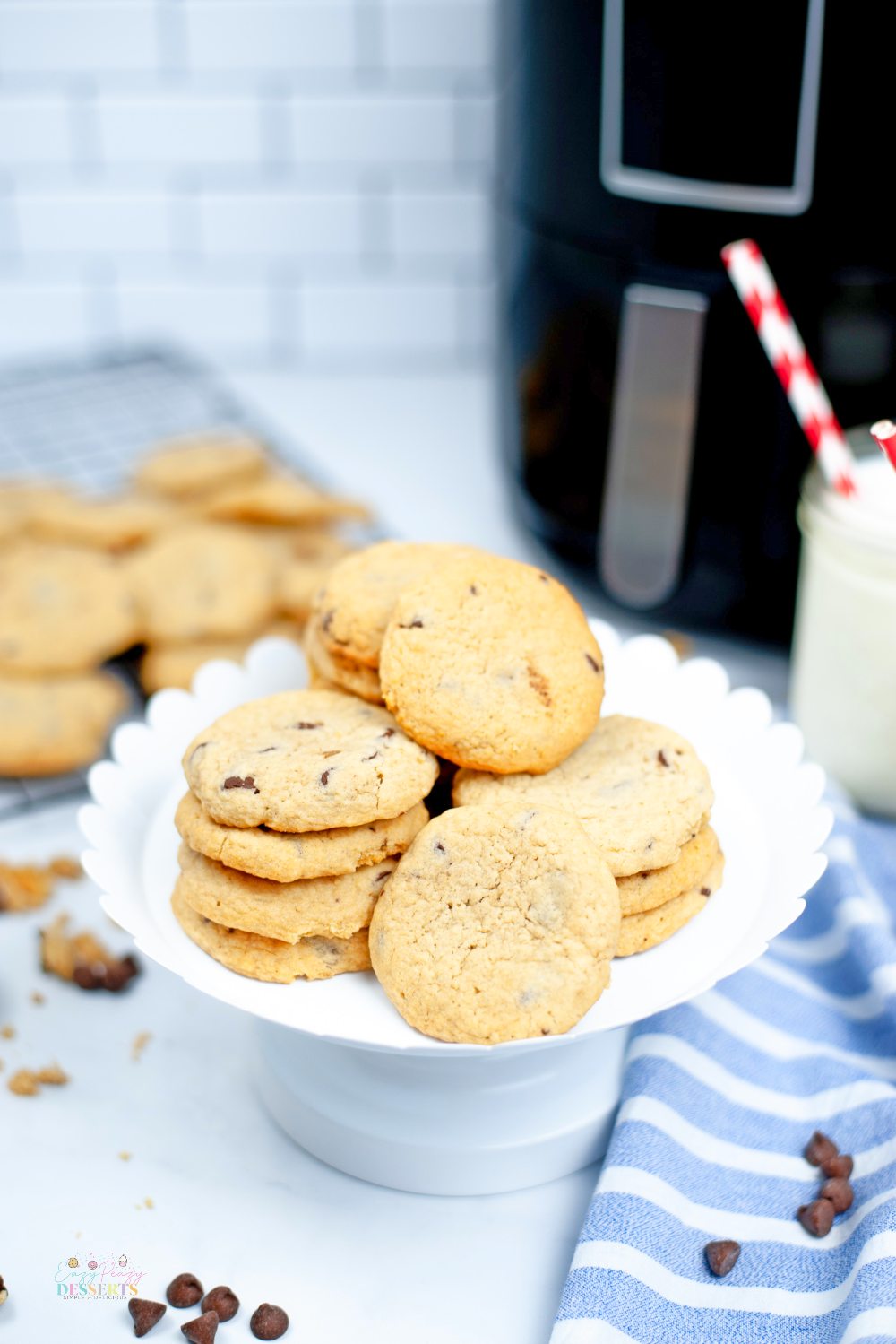 Image of air fryer chocolate chip cookies in a dessert plate, photographed from front view