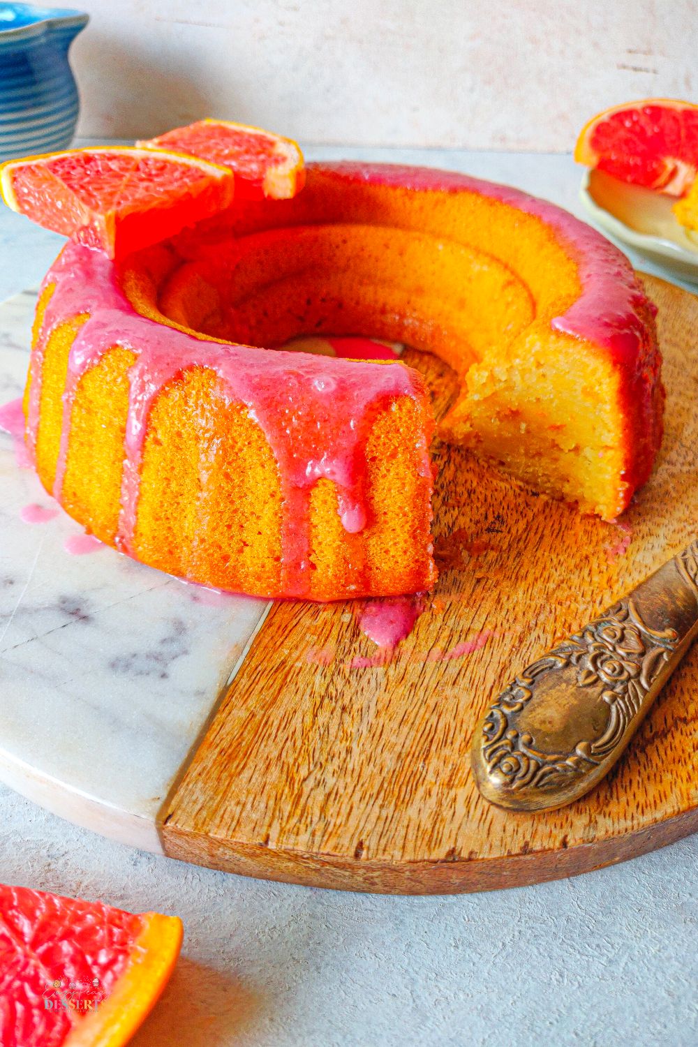 Close up image of orange bundt cake made with blood oranges and glazed
