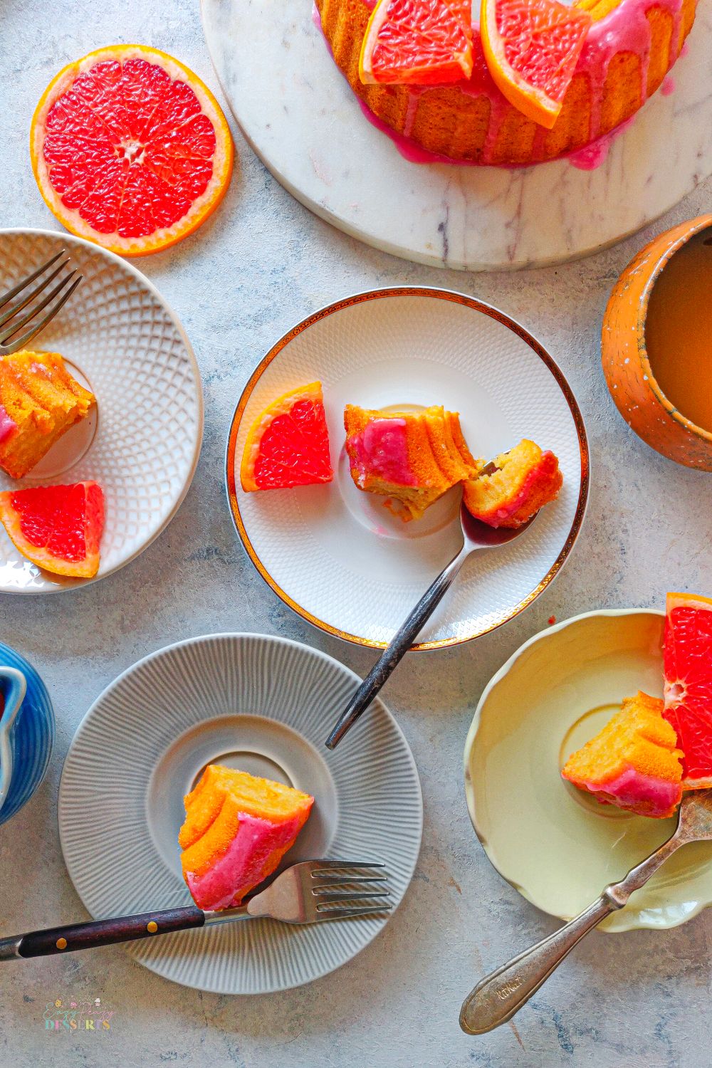 A few slices of blood orange bundt cake in dessert plates