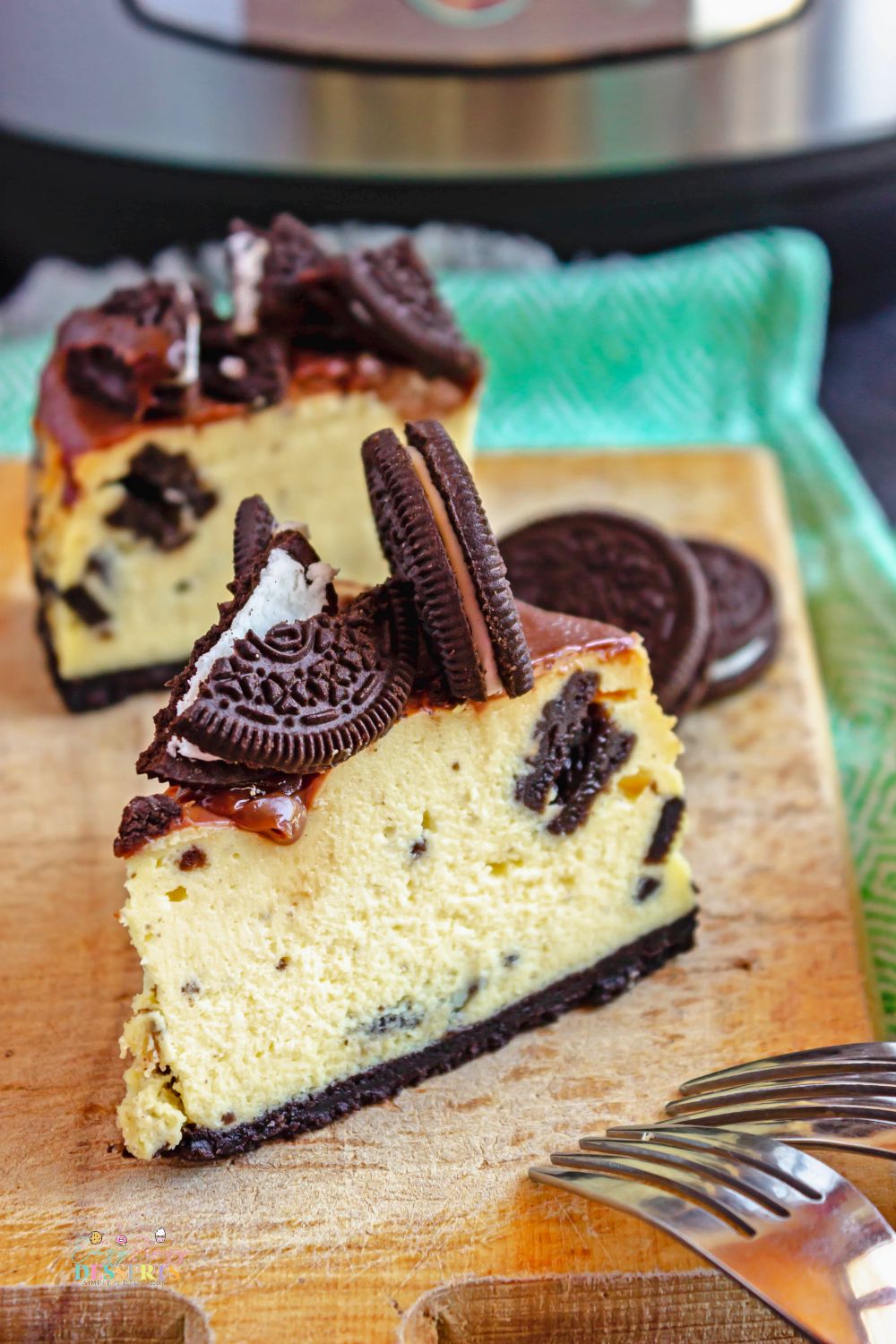 Image of a slice of Instant Pot cheesecake with Oreo cookies
