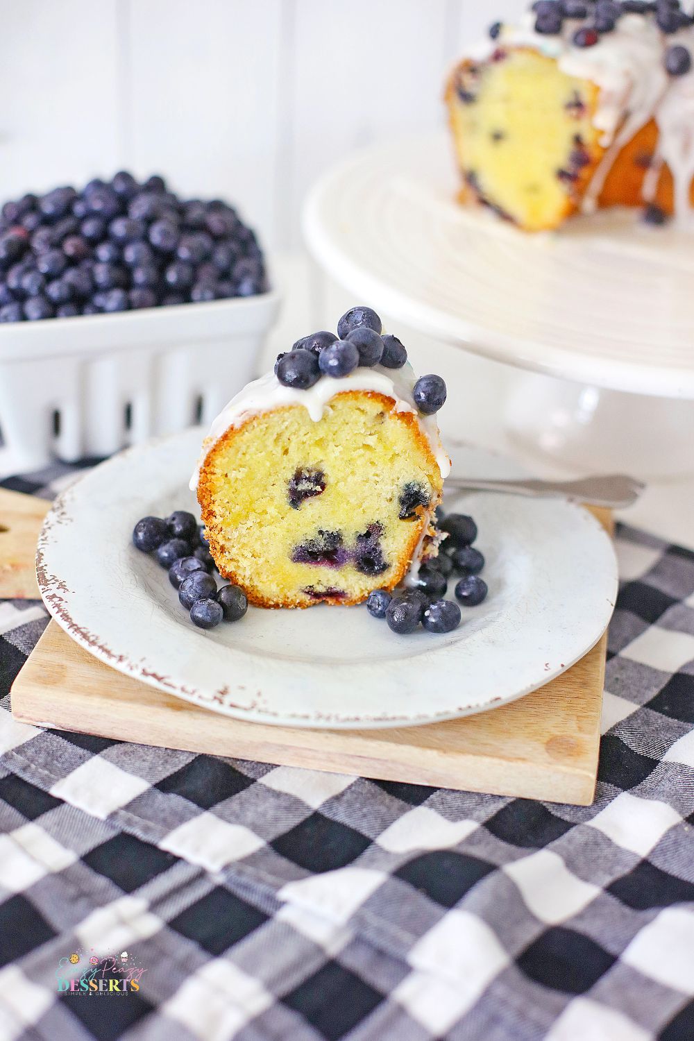 Image of a slice of blueberry Bundt cake with vanilla glaze
