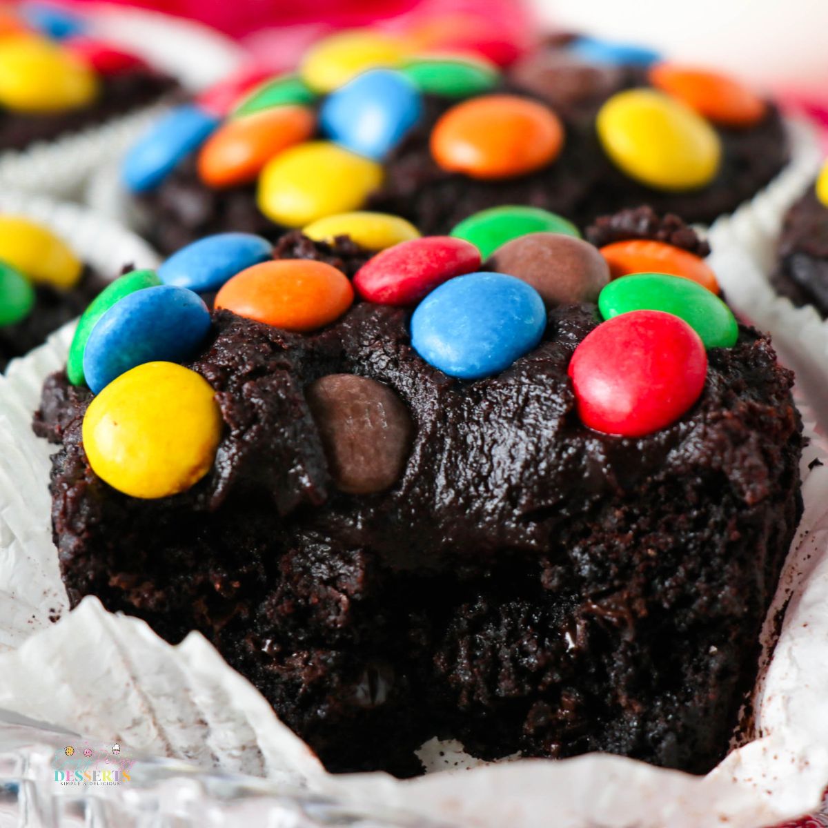 Image of brownie cupcakes with chocolate frosting and M&M's