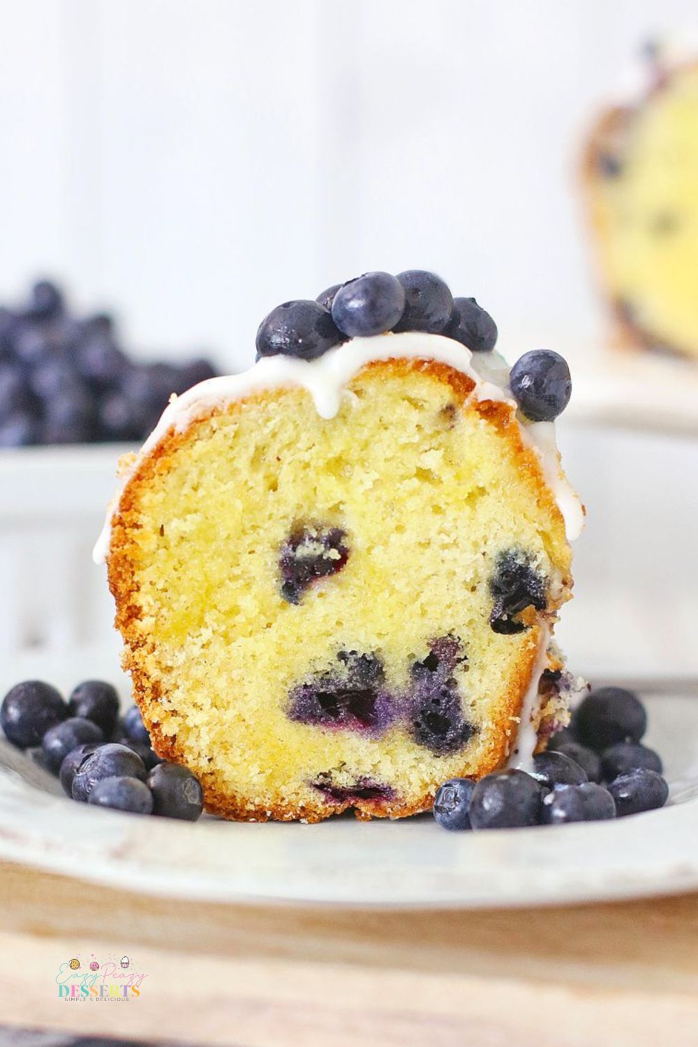 Image of donut Bundt cake with vanilla glaze and blueberries