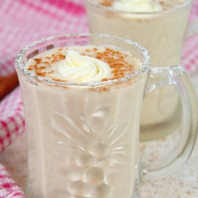 Non alcoholic eggnog in a mug decorated with whipped cream