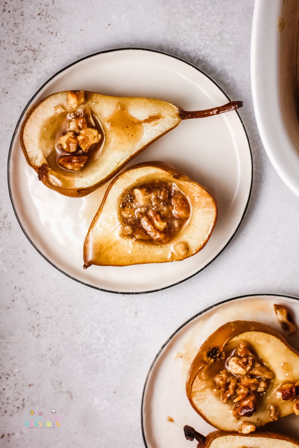 Baked pears with honey in a dessert plate