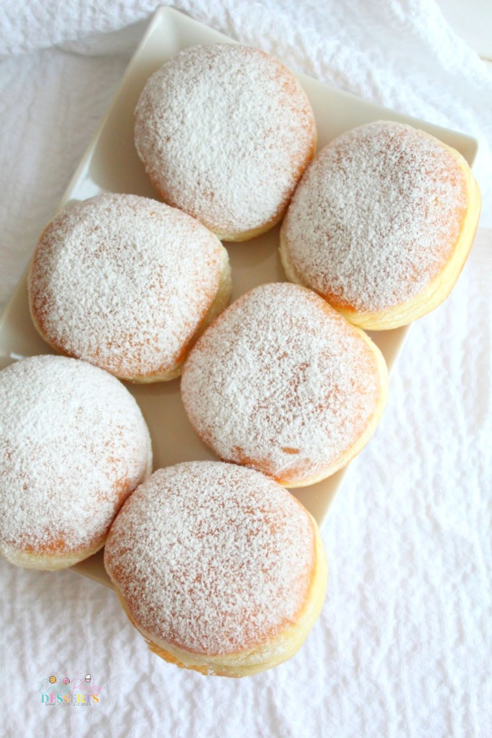 Image of six jam filled donuts on a plate