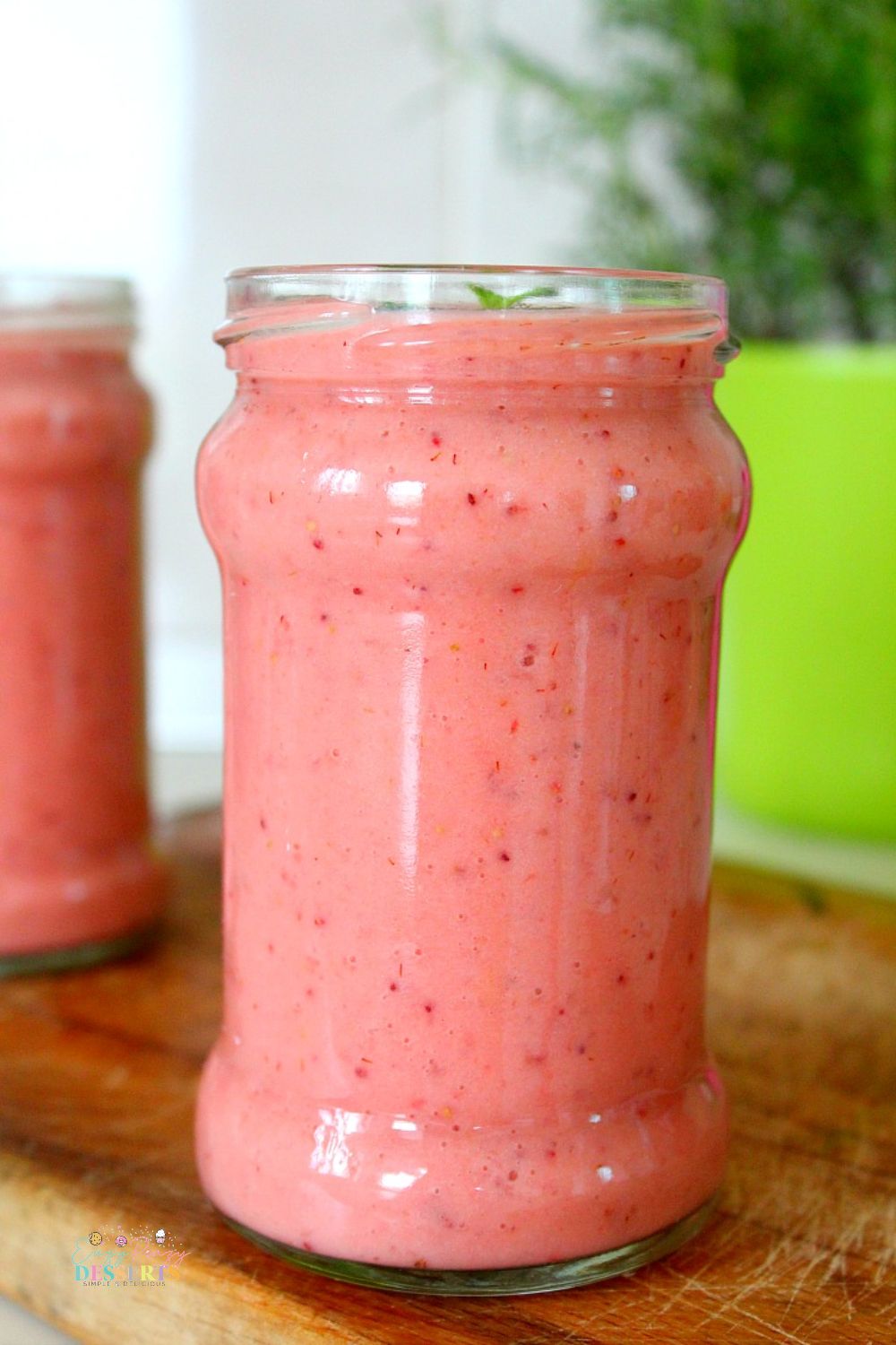 Front image of a jar filled with healthy protein fruit smoothie