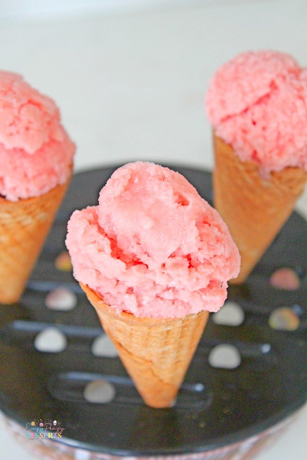 Creamy watermelon ice cream in ice cream cones