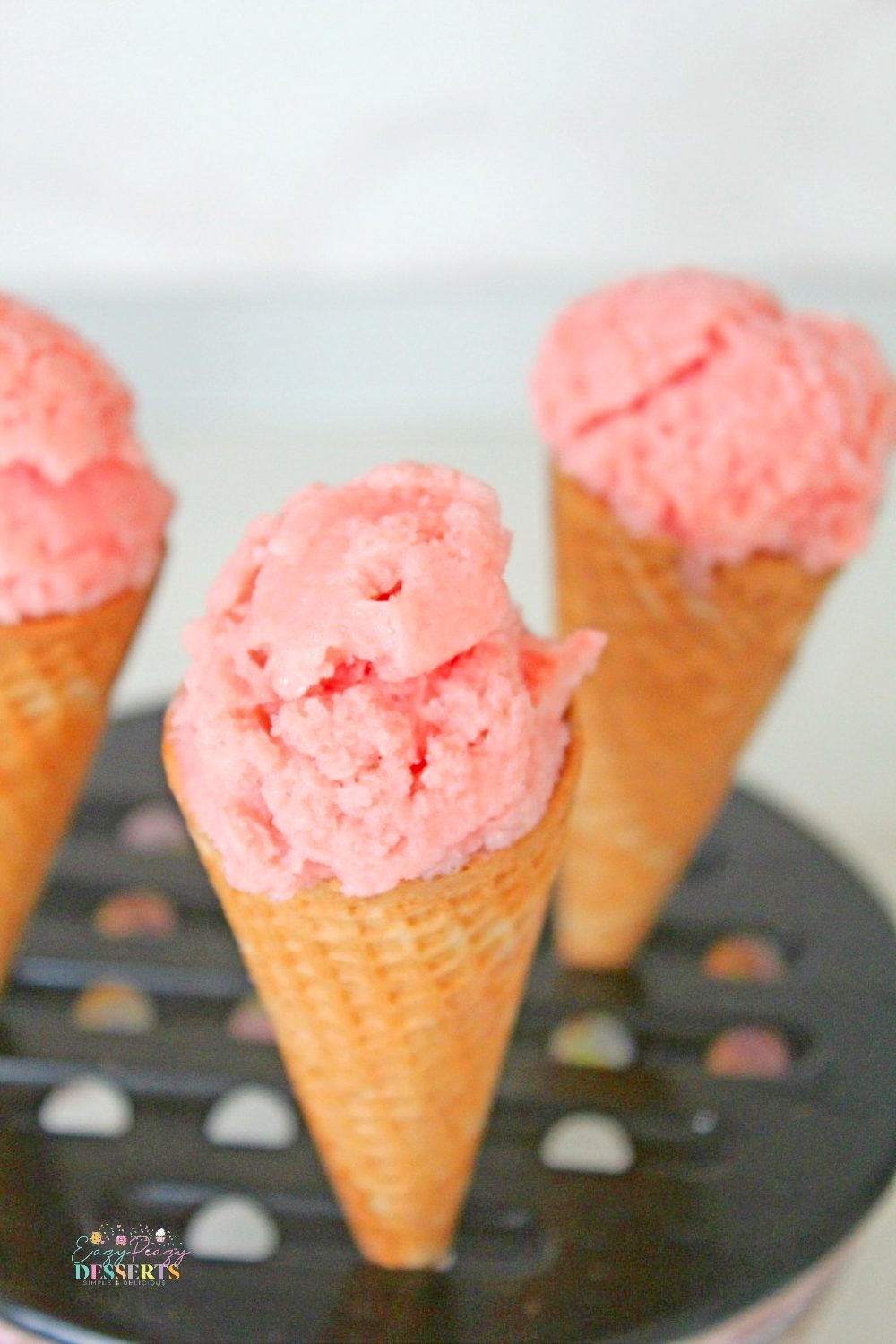 Homemade watermelon ice cream in ice cream cones