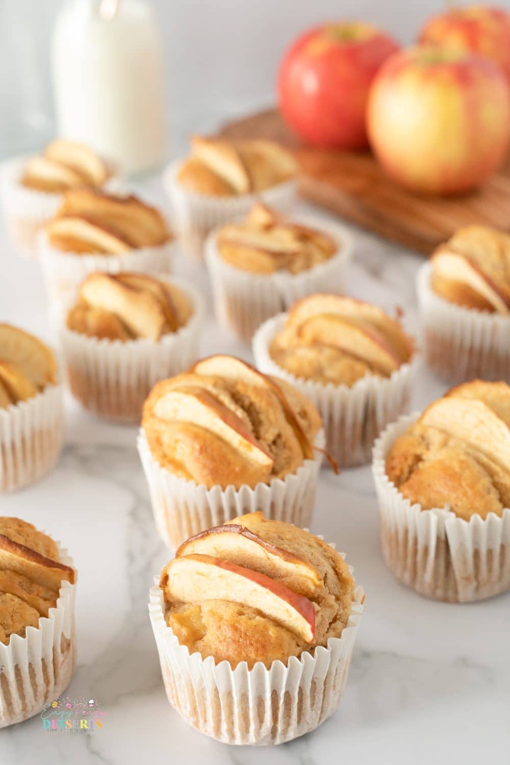 Angle image of apple and cinnamon muffins in cupcake liners