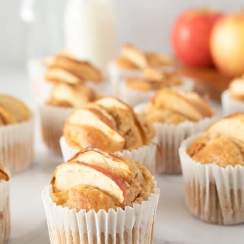 Close up image of homemade apple muffins in cupcake liners