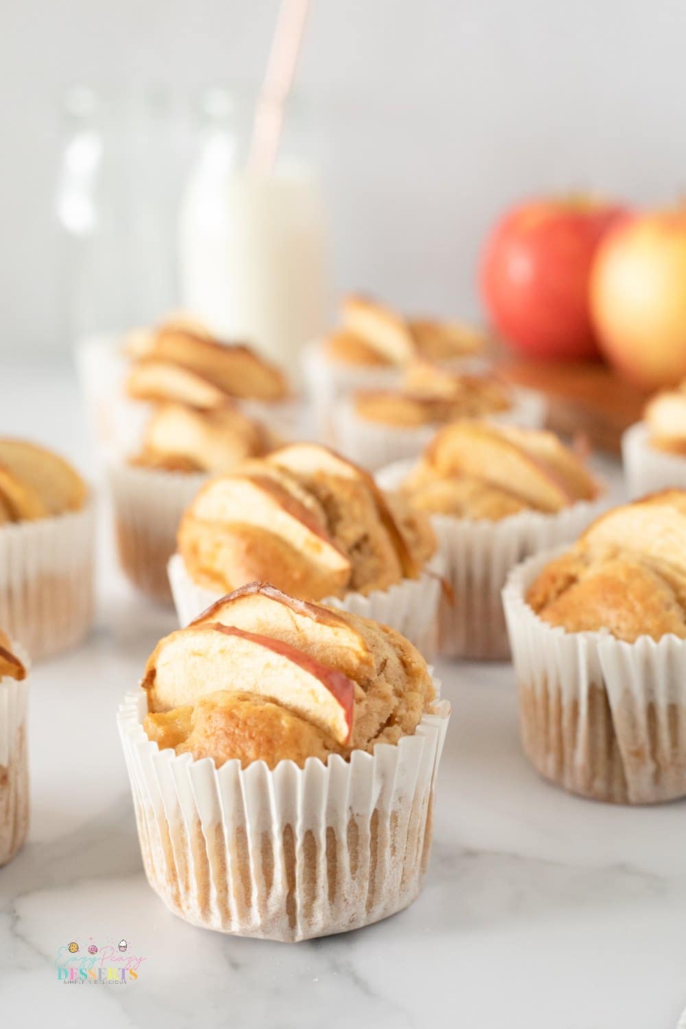 Close up image of homemade apple muffins in cupcake liners