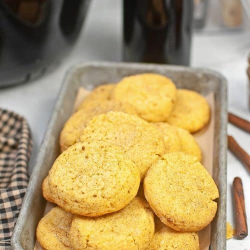 Pumpkin snickerdoodle cookies on a cookie sheet