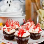 Close up image of bloody Halloween cupcakes on a serving plate