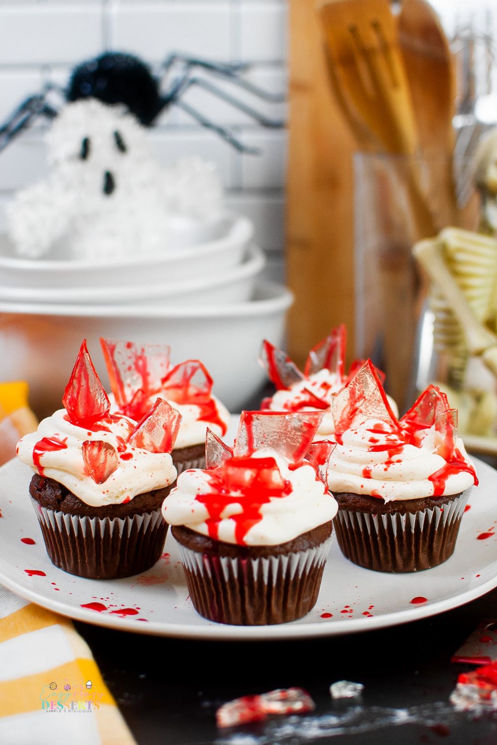 Close up image of bloody Halloween cupcakes on a serving plate