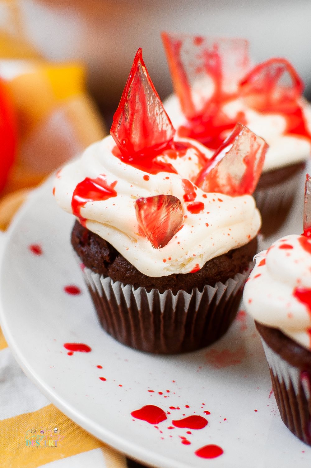 Close up image of bloody cupcakes with sugar glass shards and fake blood